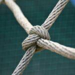 A close up of a knot on a fence