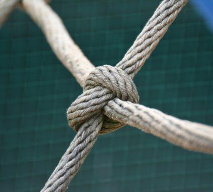 A close up of a knot on a fence