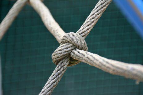 A close up of a knot on a fence