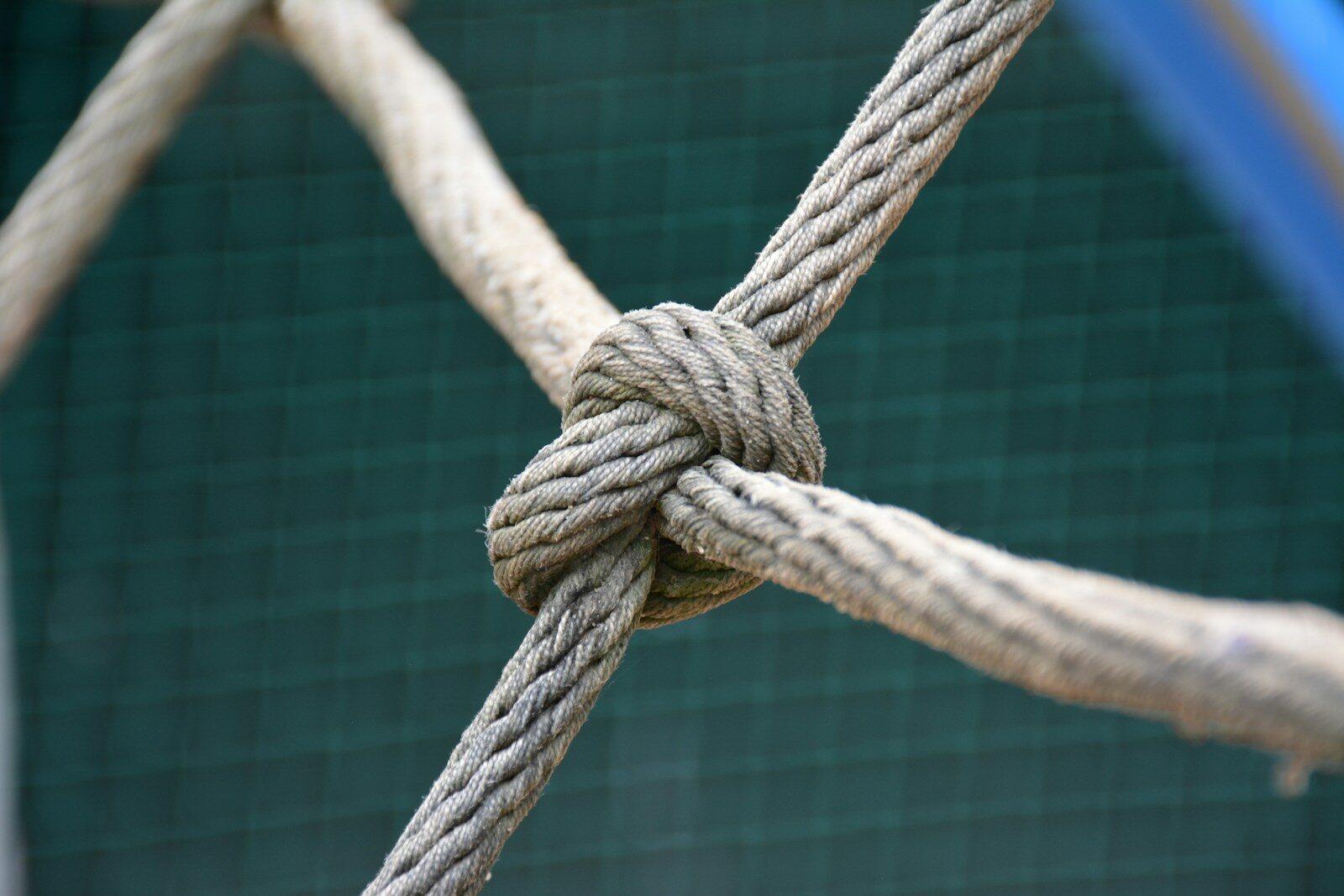 A close up of a knot on a fence