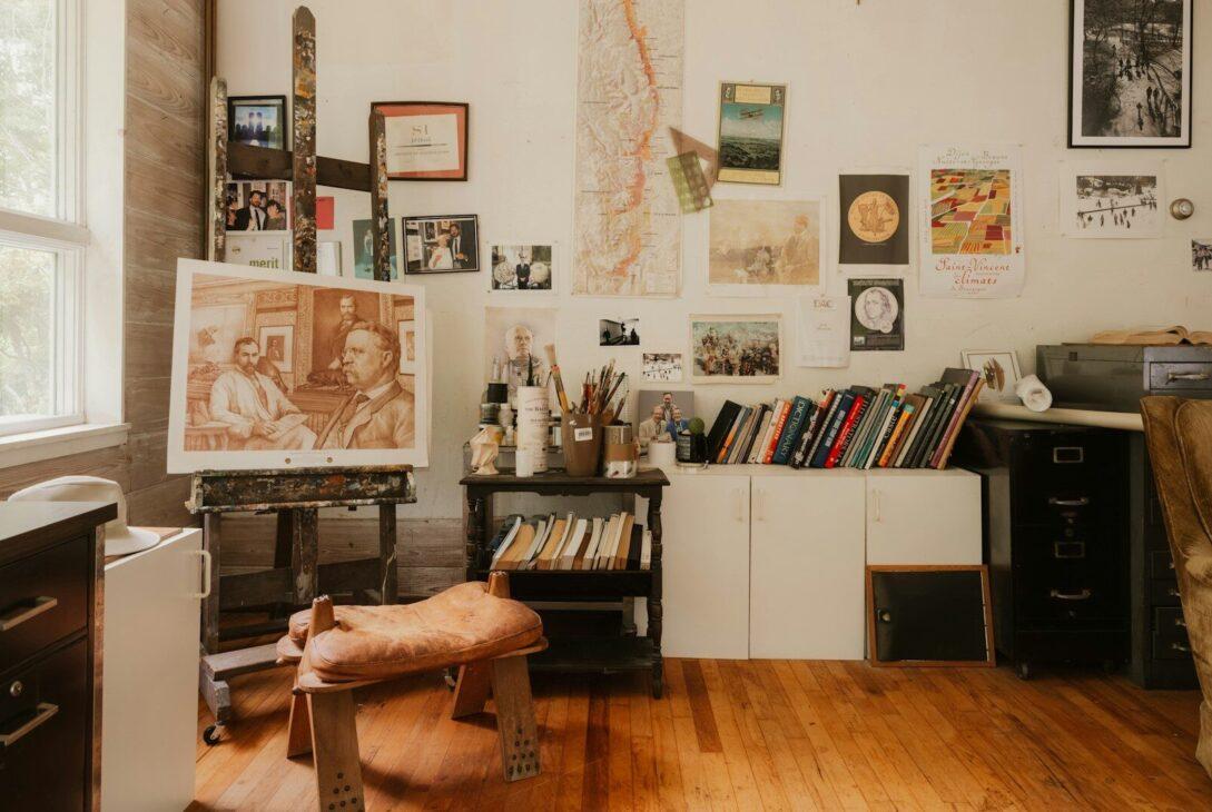 Creative artist's studio with easel, painting, and art supplies