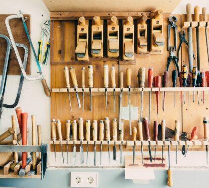 assorted handheld tools in tool rack
